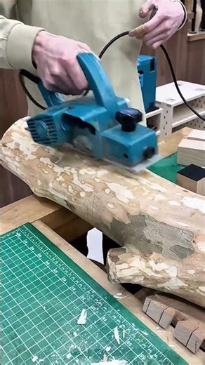 Smoothing Log Surfaces Using Electric Planer Machines To Create Neat And Precise Wood Texture