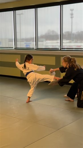 Tiger Kicks Martial Arts🥋 on Instagram: "A back kick board breaking moment from last week’s test featuring young Evelyn. Senior Assistant Brigtte supported her with steady guidance, making this a great example of teamwork and encouragement. Moments like this show how confidence is built through support, trust, and practice. ✨ #taekwondo #martialarts #boardbreaking #training #focus"
