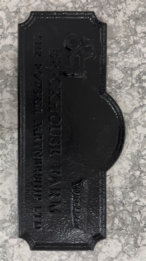 This sign is everything! 💚 I love the texture of the plaque and the crisp lettering. With the tractor on one side and wheat on the other, it's the perfect combo. Now that it's been thoroughly cleaned, it's ready for our talented artist to work their magic! #brickhousefarm #housesign #farmsign #customsigns #farmsigns | Village Green House Signs