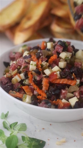 If you’re into bold, tangy flavors, this Muffaletta Olive Salad is a must-try! 🫒🍅 It’s packed with olives, giardiniera, salami, and provolone, perfect to pile on crusty bread, toss as a salad, or serve alongside your favorite cheese board. Grab the recipe here: https://www.delallo.com/recipe/muffaletta-olive-salad | DeLallo