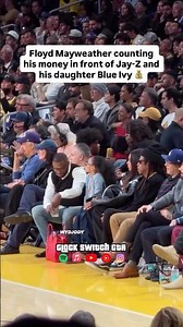 Floyd Mayweather counting his money in front of Jay-Z and Blue Ivy courtside at the Lakers game