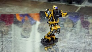 Toy android dance at one place on metal surface