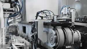 A modern automatic robot packer at a confectionery factory. Automatic packaging of goods by robot. Modern technologies.