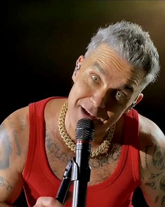 192K views · 4.2K reactions | You need to be "Strong" in that breathtaking moment when Robbie looks deep into your eyes… time stands still, your heart skips a beat, and the world around you fades away.  It requires considerable composure to remain standing, because in that gaze lies warmth, passion, and a love that touches the soul.  Credit: @curly_you #RobbieWilliams #HeartAndSoul #BritpopTour2025 #Britpop #Unforgettable | Robbie Williams • The Unforgettable Concert | Facebook