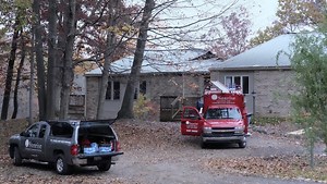 Firefighter injured battling large house fire in southwest Lansing