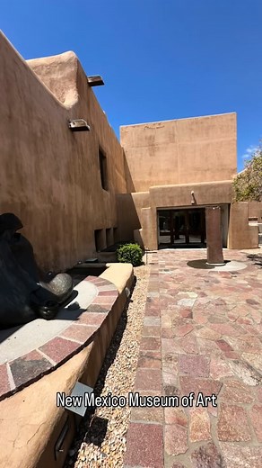 The New Mexico Museum of Art is an iconic example of Pueblo Revival architecture. It was completed in 1917. The building’s rounded corners, hand-carved corbels, battered adobe walls, and flat roofs were modeled after the nearby mission churches. The museum’s Pueblo Revival design helped define the architectural identity of the entire city. Inside, the museum honors a multitude of cultures, places, and identities through exhibitions, collections, programming and outreach, representing multiple na
