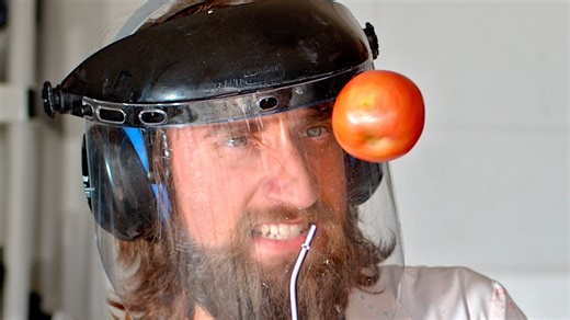 Apple explodes in slow motion.