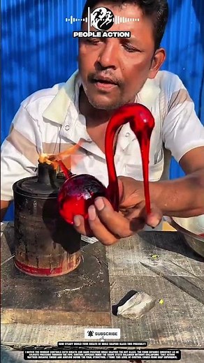Skilled Hand Shaping Molten Glass With Controlled Breath And Steady Grip