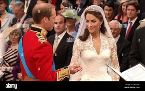In this image taken from video, Britain's Prince William, left, takes the hand of his wife, Kate, the Dutchess of Cambridge, as they stand at the altar at Westminster Abbey for the Royal Wedding in London on Friday, April, 29, 2011. (AP Photo/APTN) EDITORIAL USE ONLY NO ARCHIVE PHOTO TO BE USED SOLELY TO ILLUSTRATE NEWS REPORTING OR COMMENTARY ON THE FACTS OR EVENTS DEPICTED IN THIS IMAGE Stock Photo - Alamy