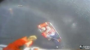Man Clings to Raft in Burning Boat Rescue