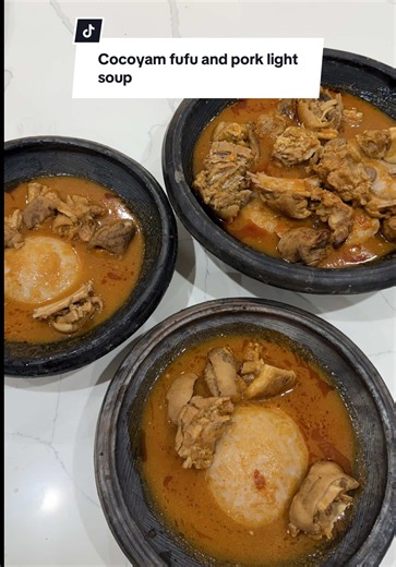 Family Members!! WE ARE BACK!!! We came with a banged, Cocoyam Fufu and Pork light soup for my family. This is just my way of saying I miss my family cos they haven't eaten from me in a month🥹❤️. Cocoyam and cassava fufu is one of Ghana's fufu combos and it's so delicious! We paired it with Pork light soup!! Pork lovers say hi I am so excited to be back to the love of my life , cooking on my coal pot!!! #FoodTiktok #foryou #viral #fyp