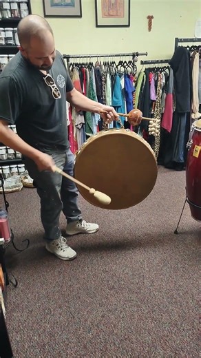 One of our customers shows off his custom made bull drum & gourd rattle