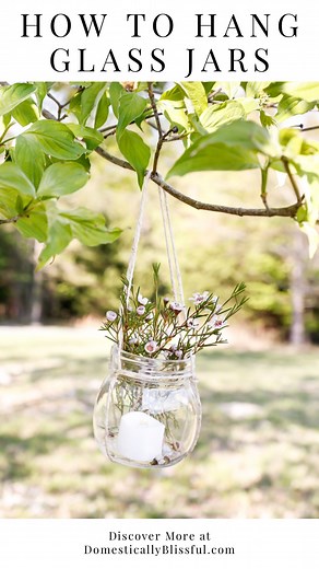 *How to Hang Glass Jars* Comment “Jars23” for the full tutorial (with linked list of materials) in your DM. This summer is our 11-year wedding anniversary! If you’ve been around since I started blogging in 2013 then you may recall that my mom and I (with a whole lot of help from friends and family) did a plethora of DIYs for our backyard wedding. From book paper wreaths to DIY doily cones filled with popcorn and nuts as a pre-wedding treat (if you do a deep dive on my blog you’ll find many of th