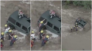 video shows moment officers rescued family who were stranded during flood