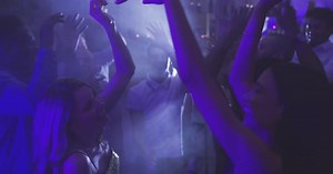 Lively Party with Dancing Young Adults at Night