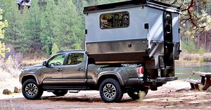 Electro-expanding pickup camper mushrooms into hard-walled cabin