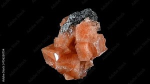 Chabazite crystals (tectosilicate mineral of the zeolite group) sample rotating slowly against a black background.