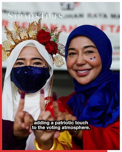 Sisters turn polling day into patriotic parade of Jalur Gemilang