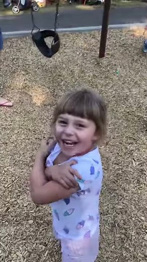 Boy falls out of swing, girl laughs