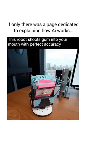 How Ai Works on Instagram: "Meet Gummy, the gum-launching robot that tracks your mouth with insane accuracy. Open wide and it fires a piece of gum right at you. In the office, it shares gum around the table, spins during meetings to hand out pieces, and even does long-distance trick shots for fun. Some call it a snack machine, others say it looks like a sentry turret. The tech behind it is seriously impressive, but the internet is already joking about what happens if you yawn at the wrong time. 