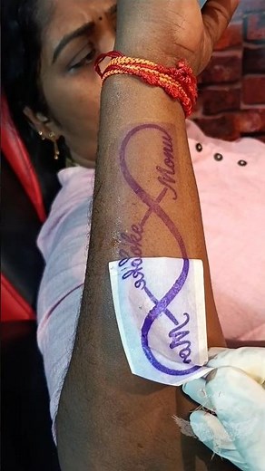 A mom’s infinity tattoo with her son’s name symbolizes eternal love, unbreakable bond. #ink