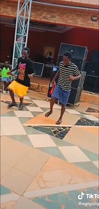 Engaging Dance Moves at a Casual Indoor Gathering