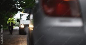 4K Female recovery driver arrives at scene of breakdown to help stranded motorist. Slow motion.