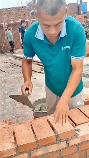 Skilled Bricklayer Carefully Aligning Each Brick to Build a Strong and Precise Wall