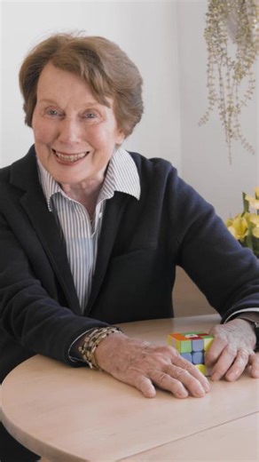 Do you know how to solve a Rubik’s Cube? Competitive World Cube Association cuber Anne Squadron, 85, demonstrates a move called “making the daisy,” the first step in solving the puzzle. AARP Members can read the full interview with Squadron at the link in the comments. | AARP