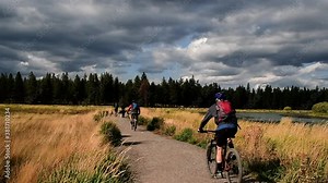 Walkers and bikers on a trail along the Deschutes River, Bend, Oregon