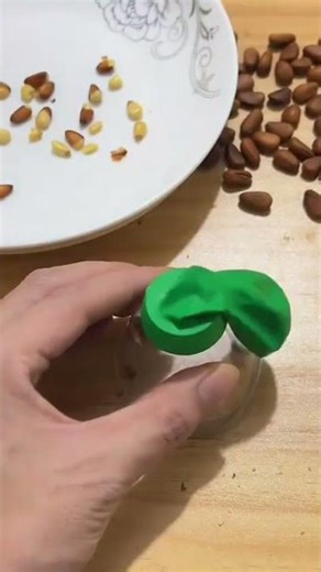 the process of cracking or peeling the shell of a nut with a snap