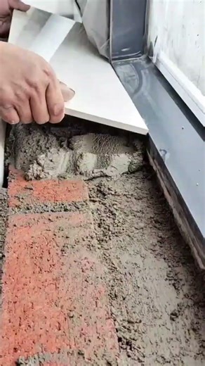 placing ceramic tile over wet mortar smoothing surface and aligning edges for neat installation