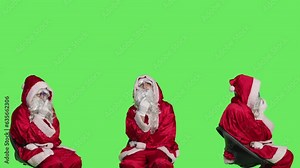 Seasonal character thinks about gifts, sitting on chair and brainstorming ideas for new presents on christmas eve. Santa claus in red costume acting pensive, preparing for winter holiday. Stock Video