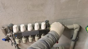 Properly Adjusting Heating Valves for Efficient Home Temperature Control in a Residential Setting Stock Footage - Video of pipes, expertise: 411376364