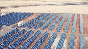 Aerial view of solar panel farm. Solar power station aerial view. Rows of solar photovoltaic panels. PV module farm in a desert. Solar energy farm high angle aerial view