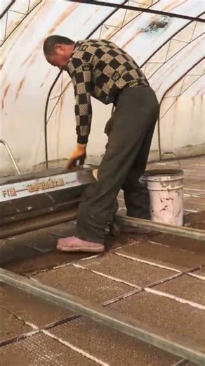 Spreading brown fertile soil precisely using a professional automatic metal machine for agriculture