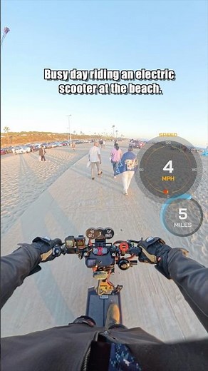 Busy day riding an electric scooter at the beach