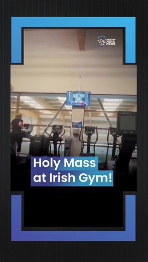 Shalom World News on Instagram: "A video circulated on social media shows a gym in Ireland with Catholic Mass being livestreamed on the television, a moment some viewers say reflects how religious tradition still figures into ordinary life in the country. The clip shared on platforms like Instagram and X shows the Mass being broadcast silently on a screen in the background as gym‑goers engage in exercise. While this specific incident hasn’t yet been widely covered in mainstream news outlets, som