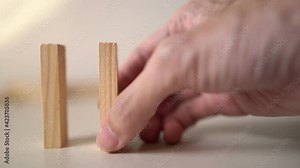 Set up dominoes on a table