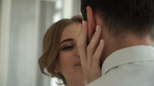 Bride pats on the shoulder groom