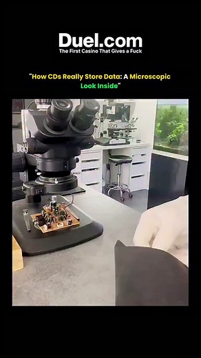 The Curious Core on Instagram: "Take a microscopic look inside a CD and see how it stores data. CDs use a spiral track of tiny pits and lands that reflect light differently. A laser reads those reflections and turns them into binary code—turning dents into music, videos, and files."