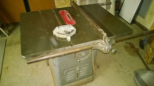 Old Delta Unisaw with new aftermarket fence, and regrets