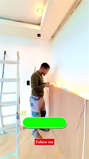 Custom master bedroom headboard installation featuring textured stone, wood panel finishes, LED ambient lighting, and modern pendant bedside lights. The lighting is controlled through a four-gang smart switch system, creating a perfect balance between smart home technology, luxury lighting design, and modern interior finishes. Ideal inspiration for custom headboards, feature walls, LED installations, and smart lighting setups in modern bedrooms. #SmartHome #LEDLighting #FeatureWall #BedroomDesig