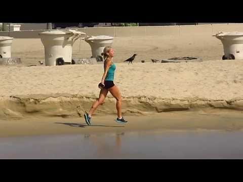 SUPER FIT GIRL RUNNING THE BEACH IN SLOW MOTION in HD