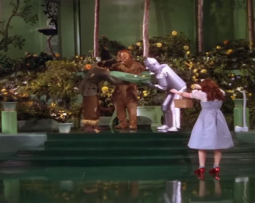🎥 Judy Garland, Bert Lahr, Ray Bolger and Jack Haley in 1939’s “The Wizard of Oz.” This musical sequence is so colorful, I’ve always loved looking at the scenery around the lion as he performs, and his broken vase crown. | The Oz Archive