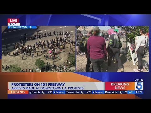ICE protesters briefly close 101 Freeway in downtown L.A.