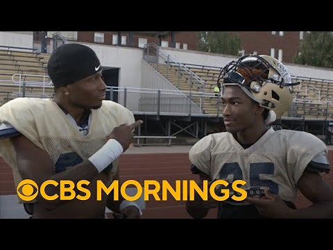 Gallaudet football players communicate with sign language