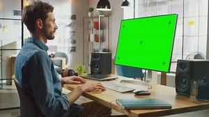 clip-1030955576-young-professional-creative-employee-works-on-his