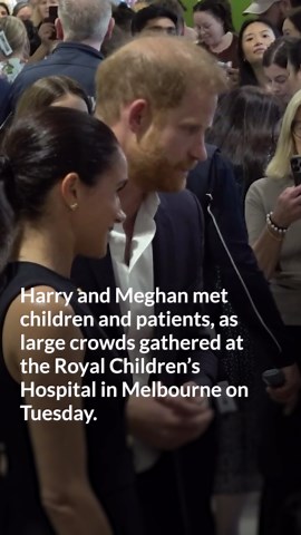 Harry and Meghan hug patients as hundreds greet them at children’s hospital