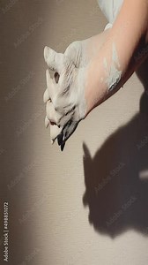 romantic movements of hands, a couple in love. smooth movements of male and female hands close-up, in a pottery workshop, all in clay. vertical video